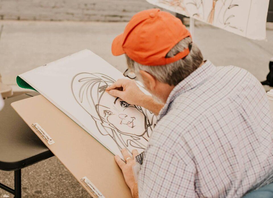 a talented man drawing an artwork